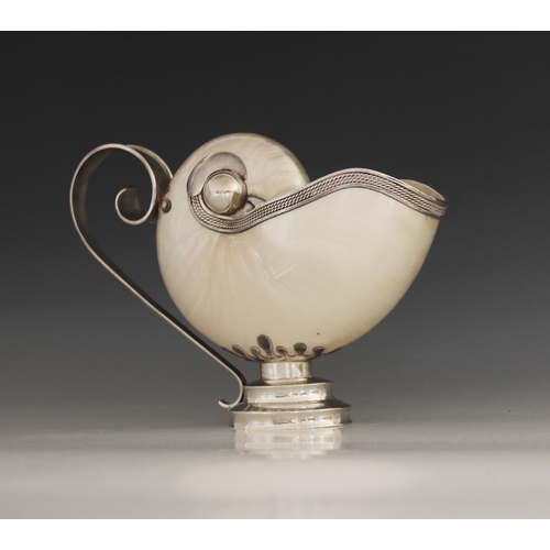 18 - A Tiffany & Co silver mounted nautilus shell ewer, 20th century, the shell of typical form with rope... 