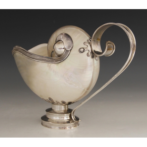 18 - A Tiffany & Co silver mounted nautilus shell ewer, 20th century, the shell of typical form with rope... 