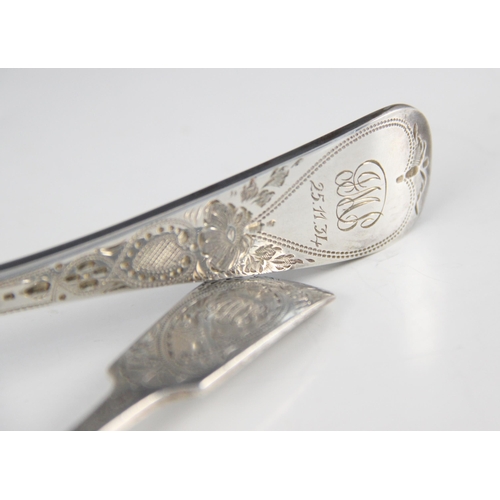 21 - A George V fiddle pattern silver tablespoon, C T Maine Ltd, London 1933, with bright cut decoration ... 