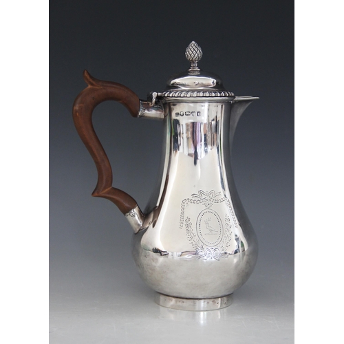 32 - A Victorian silver hot water jug, Lowe & Sons, Chester 1880, of baluster form on circular foot with ... 