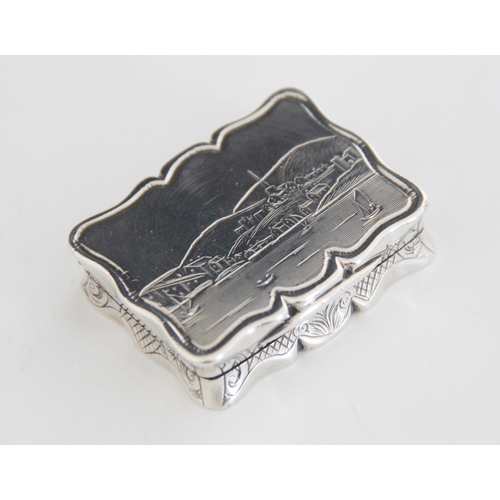 47 - A Victorian silver vinaigrette, Edward Smith, Birmingham 1847, of shaped rectangular form, the cover... 
