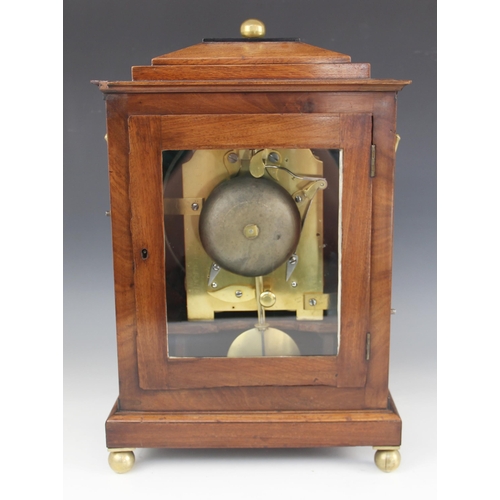 575 - A Regency mahogany bracket clock by Robert Neill, Belfast, the stepped cornice with a sphere finial ... 