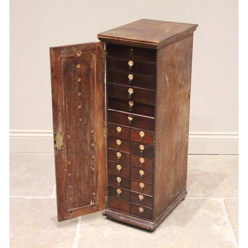 592 - A George III mahogany haberdashery/collectors cabinet, the single door opening to an arrangement of ... 