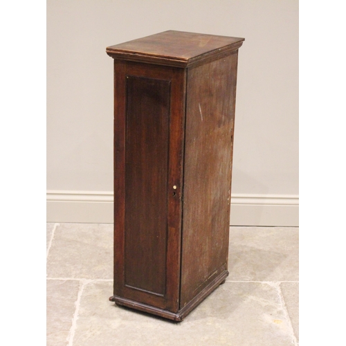 592 - A George III mahogany haberdashery/collectors cabinet, the single door opening to an arrangement of ... 