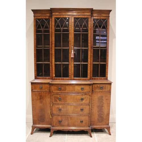 593 - A George IV style mahogany breakfront bookcase, late 20th century, the moulded cornice above four Go... 