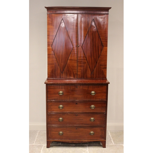 596 - A late George III mahogany secretaire bookcase, the moulded cornice over a pair of segmentally venee... 