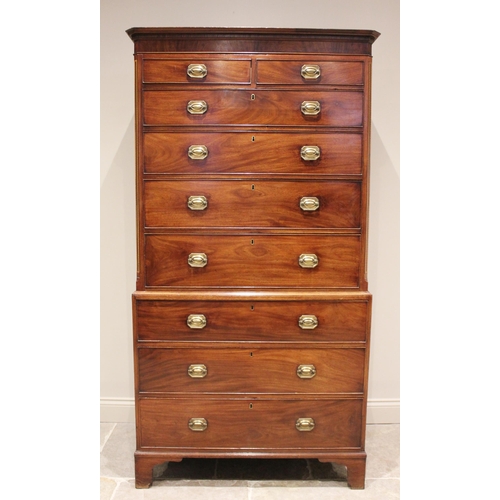 601 - A late George III mahogany chest on chest, the moulded and simulated dentil cornice above an arrange... 