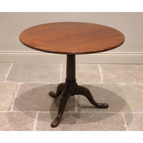 607 - A George III mahogany tilt top tripod table, the circular top raised upon a bird cage mechanism and ... 