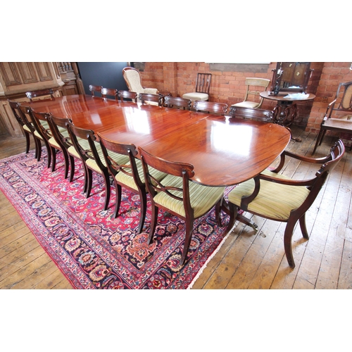 608 - A Regency style mahogany triple pillar dining table, early 20th century, possibly by Maple & Co, the... 