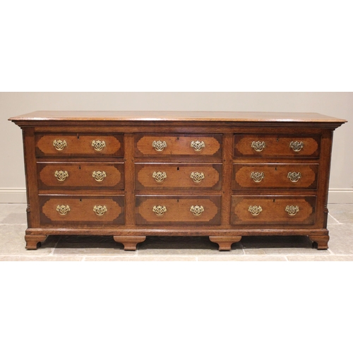 612 - A George III oak and mahogany crossbanded dresser base, the rectangular moulded plank top above an a... 