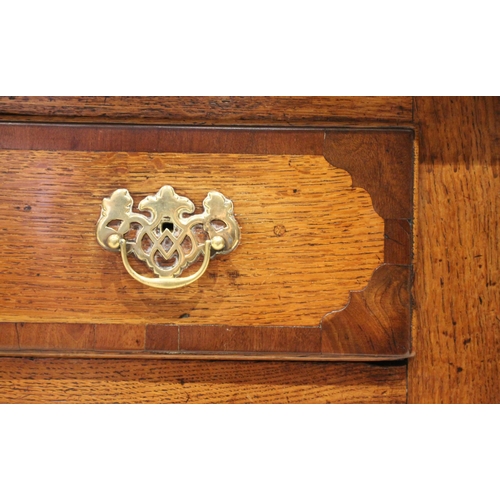 612 - A George III oak and mahogany crossbanded dresser base, the rectangular moulded plank top above an a... 