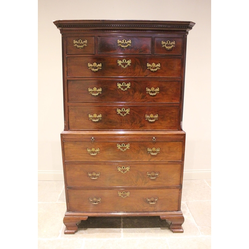 613 - A George III mahogany chest on chest, with a moulded dentil cornice over three short and three long ... 