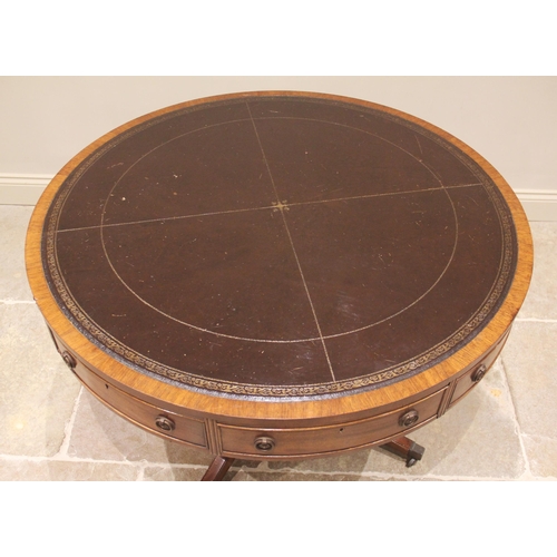 616 - A Regency style mahogany library drum table, late 20th century, the gilt tooled inset skiver above s... 