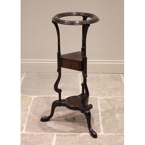 617 - A George III mahogany wig/wash stand, the moulded circular collar above a triangular tier with a sin... 