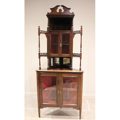 645 - A late 19th century rosewood and inlaid free-standing corner display cabinet, with open work galleri... 