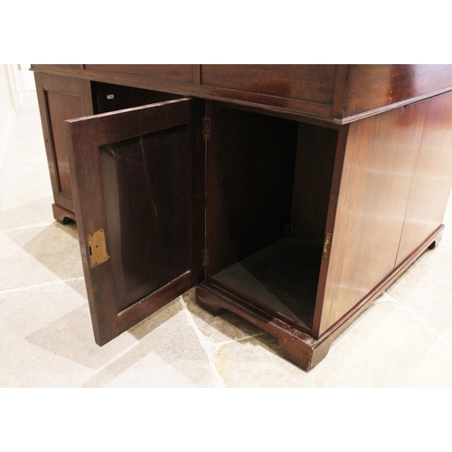 647 - A Victorian mahogany twin-pedestal desk, the rectangular moulded top with a later inset skiver over ... 