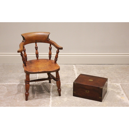 652 - A Victorian child's ash and beech captains chair, with turned baluster spindles above a shaped seat,... 