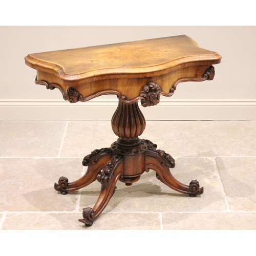 654 - A Victorian figured walnut pedestal card table, the serpentine book veneered top opening to a baize ... 