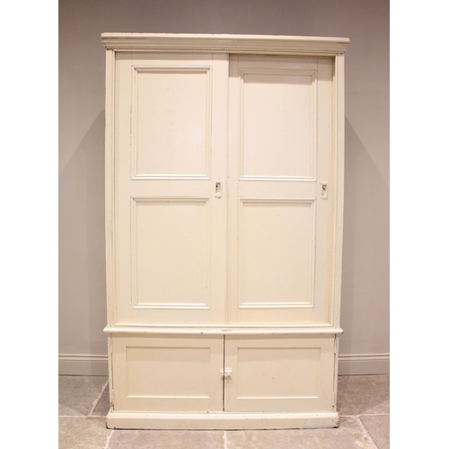 657 - A Victorian painted pine housekeepers cupboard, the moulded cornice above a pair of sliding panelled... 