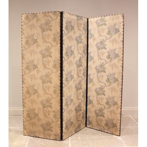 660 - A late Victorian ebonised three fold room screen, the foliate fabric panels with peripheral stud det... 