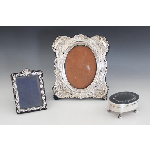 67 - An Edwardian silver mounted jewellery box, Synyer & Beddoes, Birmingham 1904, of oval form raised on... 