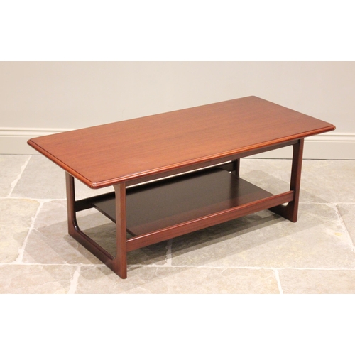 671 - A McIntosh teak coffee table, the rectangular moulded top raised upon quadrangle supports united by ... 