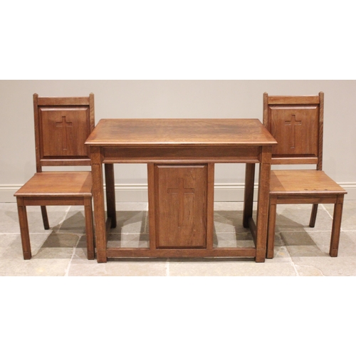 674 - A mid 20th century honey oak altar table and two conforming side chairs, the table with a rectangula... 