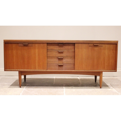 678 - A mid 20th century 'Long John' style teak sideboard, the four central tambour effect drawers flanked... 