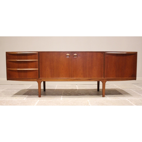 679 - A mid 20th century McIntosh of Kirkcaldy teak sideboard, the pair of central cupboard doors flanked ... 