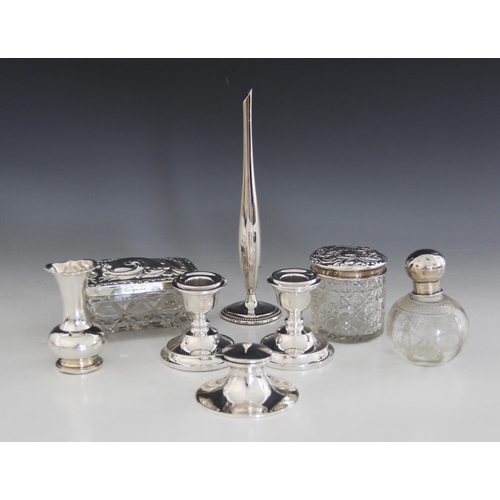 68 - A selection of silver mounted and silver coloured tableware, to include a silver mounted capstan ink... 