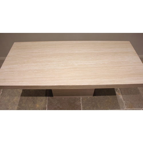 680 - A contemporary limestone table, late 20th/early 21st century, the rectangular top raised upon a sing... 