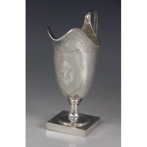 73 - A George III silver helmet shaped cream jug, Peter & Ann Bateman, London 1793, with bright cut decor... 