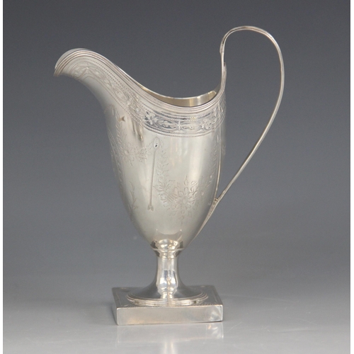 73 - A George III silver helmet shaped cream jug, Peter & Ann Bateman, London 1793, with bright cut decor... 