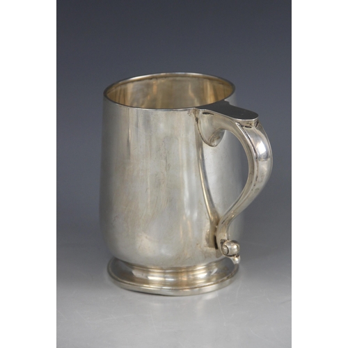 75 - A George VI silver mug, William Suckling Ltd, Birmingham 1942, of tapering cylindrical form on circu... 