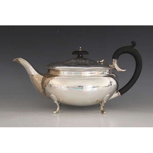 77 - A George V silver teapot, B Street & Co, Birmingham 1930, of compressed oval form with rope twist bo... 