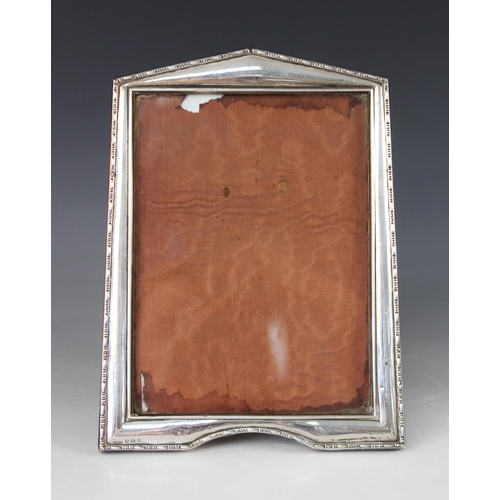 85 - An Art Deco silver mounted photograph frame, Henry Williamson Ltd, Birmingham 1921, of tapered recta... 