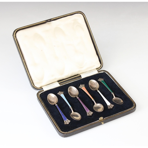 91 - Six silver and enamel coffee spoons by Magnus Aase, each with tapering handle and pierced scrolling ... 