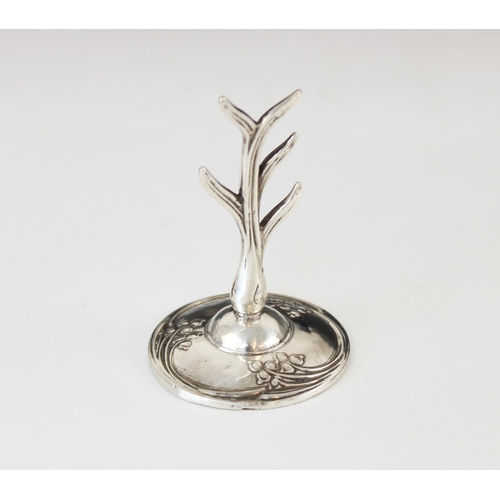 97 - An Art Nouveau silver ring tree, WJ Myatt & Co, Birmingham 1917, the stylized silver tree upon a wei... 