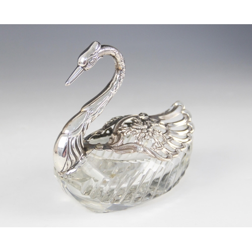 98 - A continental cut glass silver mounted swan salt, import marks for 'ELd', London 1977, the cut glass... 