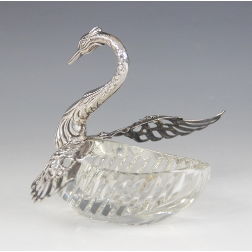 98 - A continental cut glass silver mounted swan salt, import marks for 'ELd', London 1977, the cut glass... 