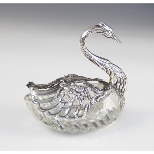 98 - A continental cut glass silver mounted swan salt, import marks for 'ELd', London 1977, the cut glass... 