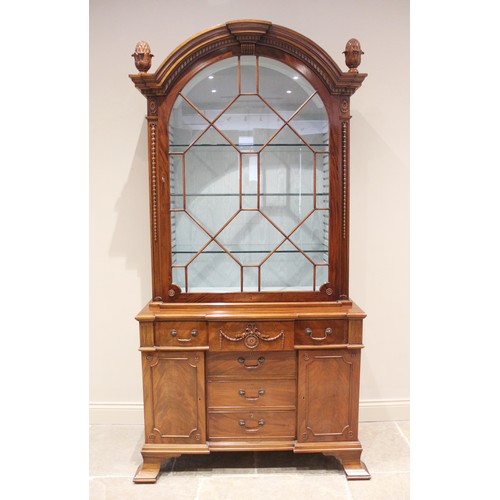 664A - A Queen Anne style mahogany display cabinet, late 20th century, the arched top flanked by fruit fini... 