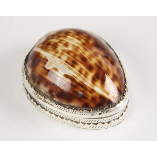 89 - An 18th century cowrie shell snuff box, the silver coloured mounts with punched dot detail, hinged c... 