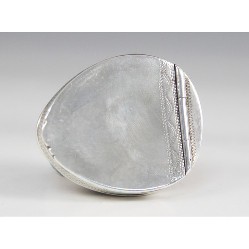 89 - An 18th century cowrie shell snuff box, the silver coloured mounts with punched dot detail, hinged c... 