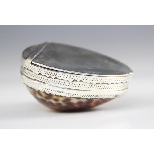 89 - An 18th century cowrie shell snuff box, the silver coloured mounts with punched dot detail, hinged c... 