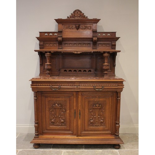 643 - A late 19th/early 20th century French carved oak and rouge marble buffet sideboard, the architectura... 