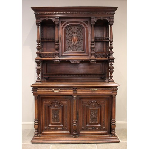 644 - A late 19th/early 20th century French walnut dresser, the raised back with a central carved cupboard... 