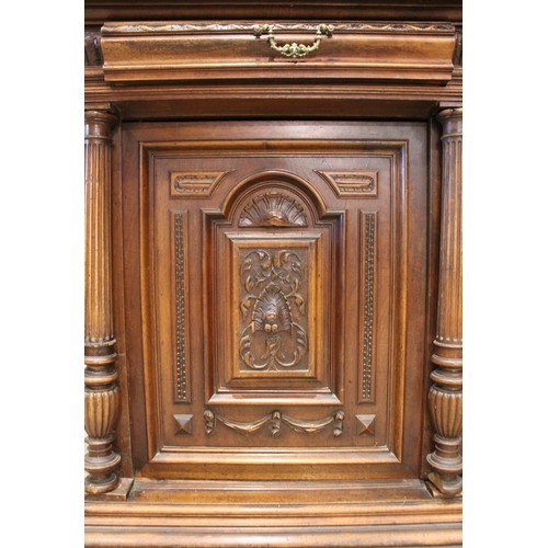 644 - A late 19th/early 20th century French walnut dresser, the raised back with a central carved cupboard... 