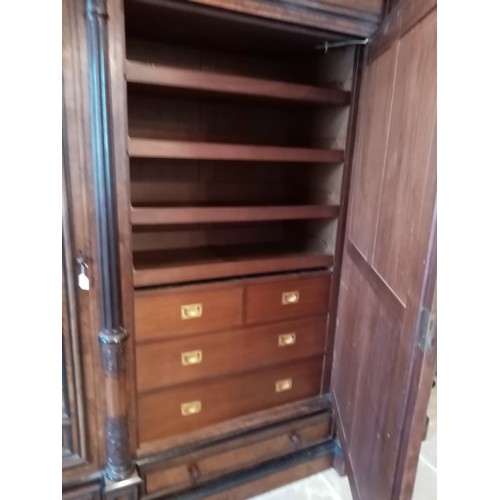 651 - A large and impressive late 19th century French figured walnut compactum wardrobe, of architectural ... 