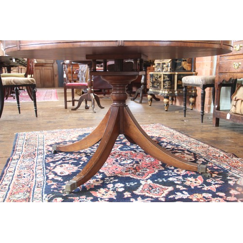 616 - A Regency style mahogany library drum table, late 20th century, the gilt tooled inset skiver above s... 